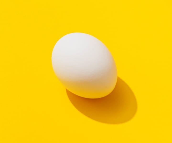 An egg with yellow background